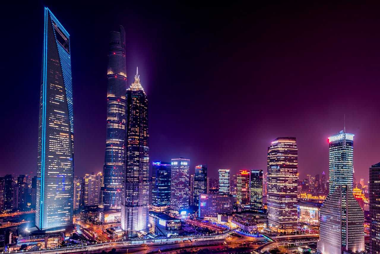 Majestic view of Shanghai's illuminated skyline featuring iconic skyscrapers at night.