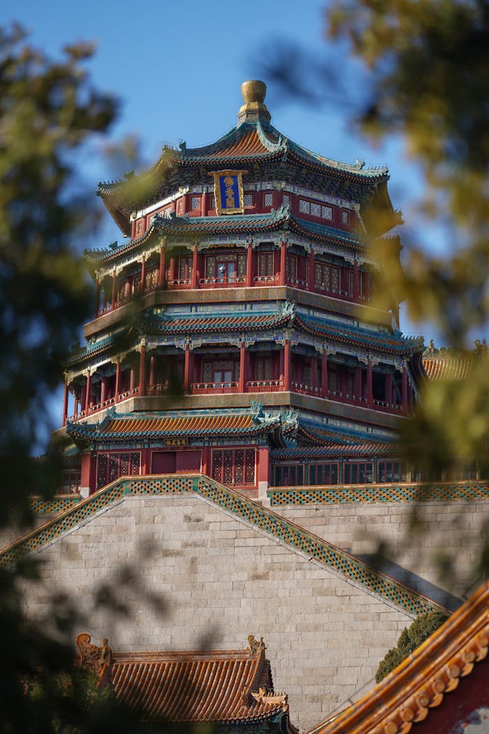 Stunning architectural detail of the Summer Palace pagoda surrounded by nature.