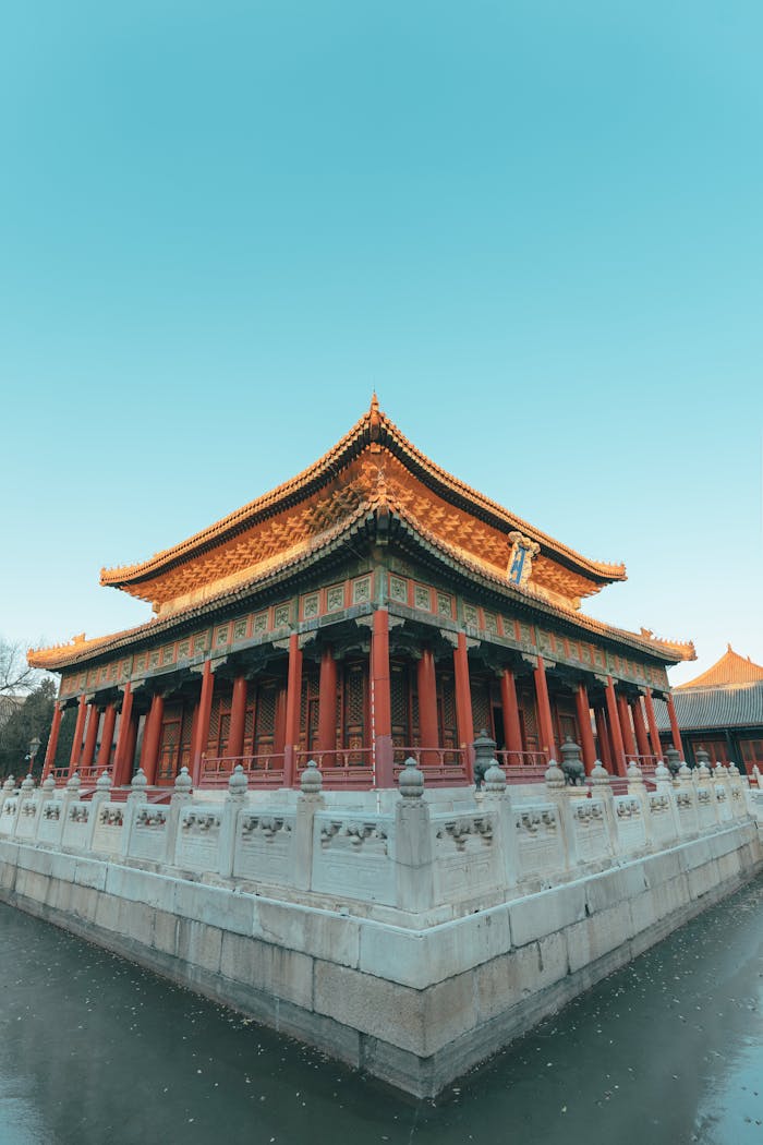 A stunning view of a traditional Chinese temple in Beijing under a clear blue sky.